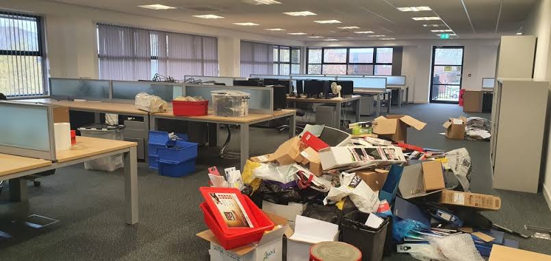 Open-plan office being cleared of desks chairs and cardboard on a wait-and-load collection in Holloway — Rubbish-Collection.com