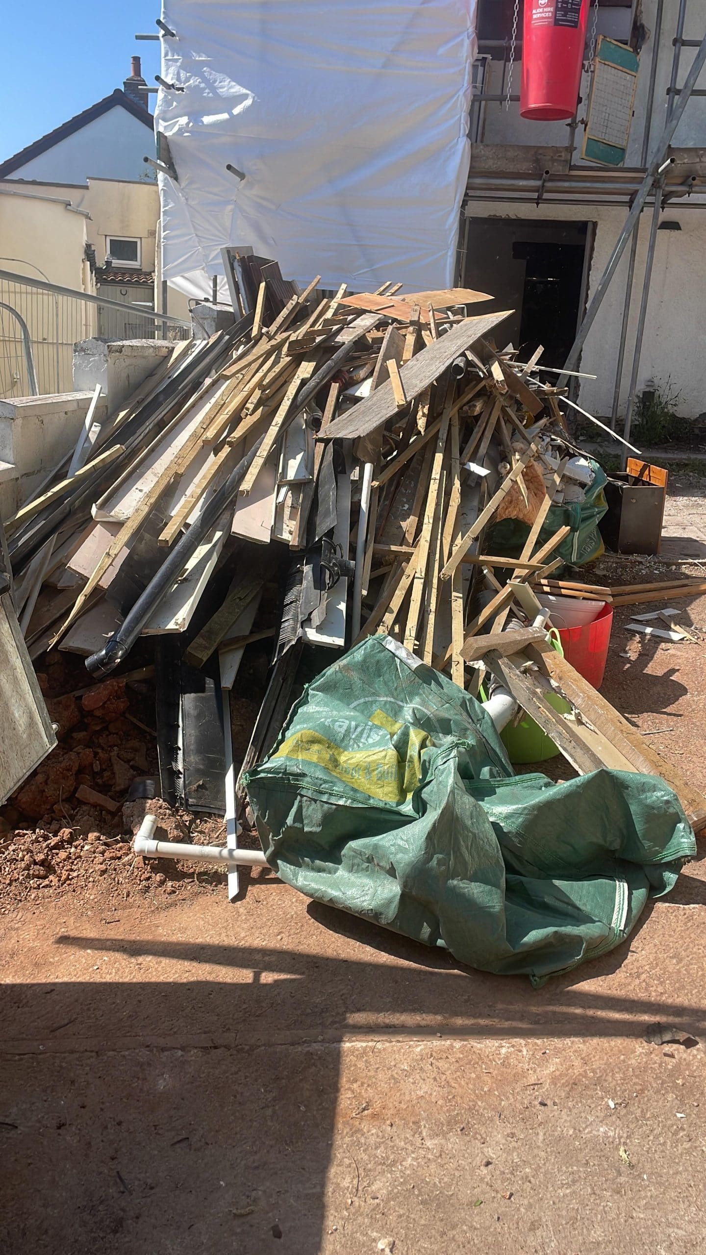 Builders waste including timber offcuts and scaffolding boards collected from a property in Lessness Heath — Rubbish-Collection.com